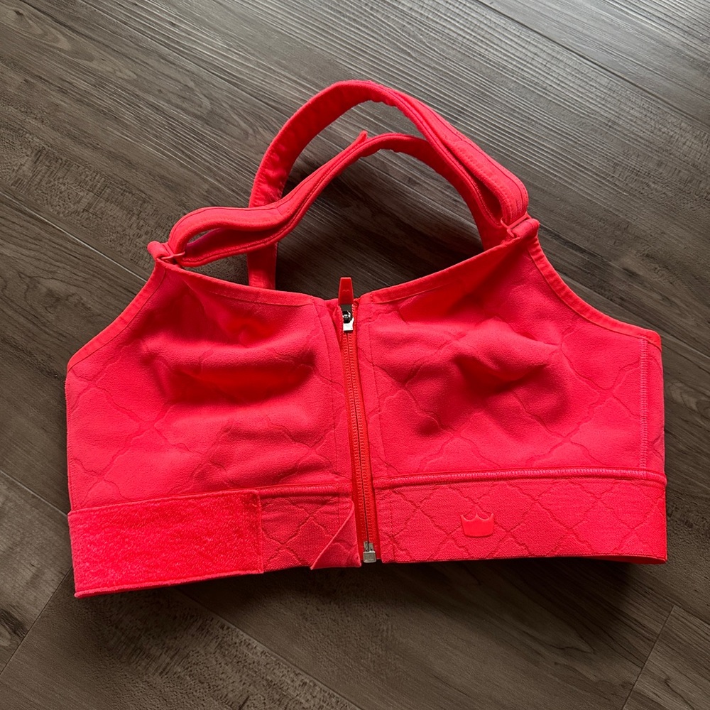 Medium SheFit ultimate sports bra in coral color